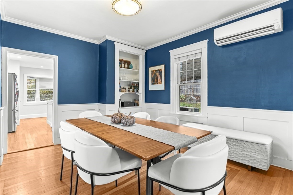 55 Redlands Road Boston, MA 02132 - Photo 10 of 42 a view of a dining room with furniture window and wooden floor