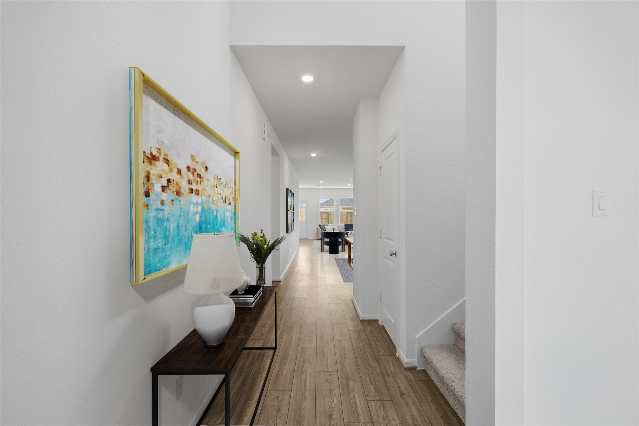 21918 Longhorn Rdg Drive Hockley, TX 77447 - Photo 23 of 46 a view of a hallway with wooden floor and a potted plant