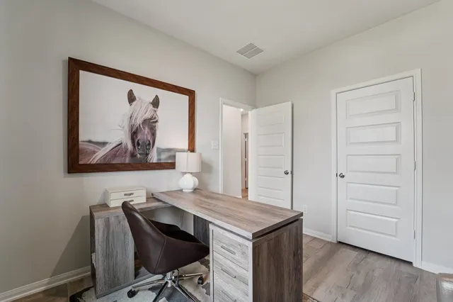 a view of a livingroom with furniture and wooden floor