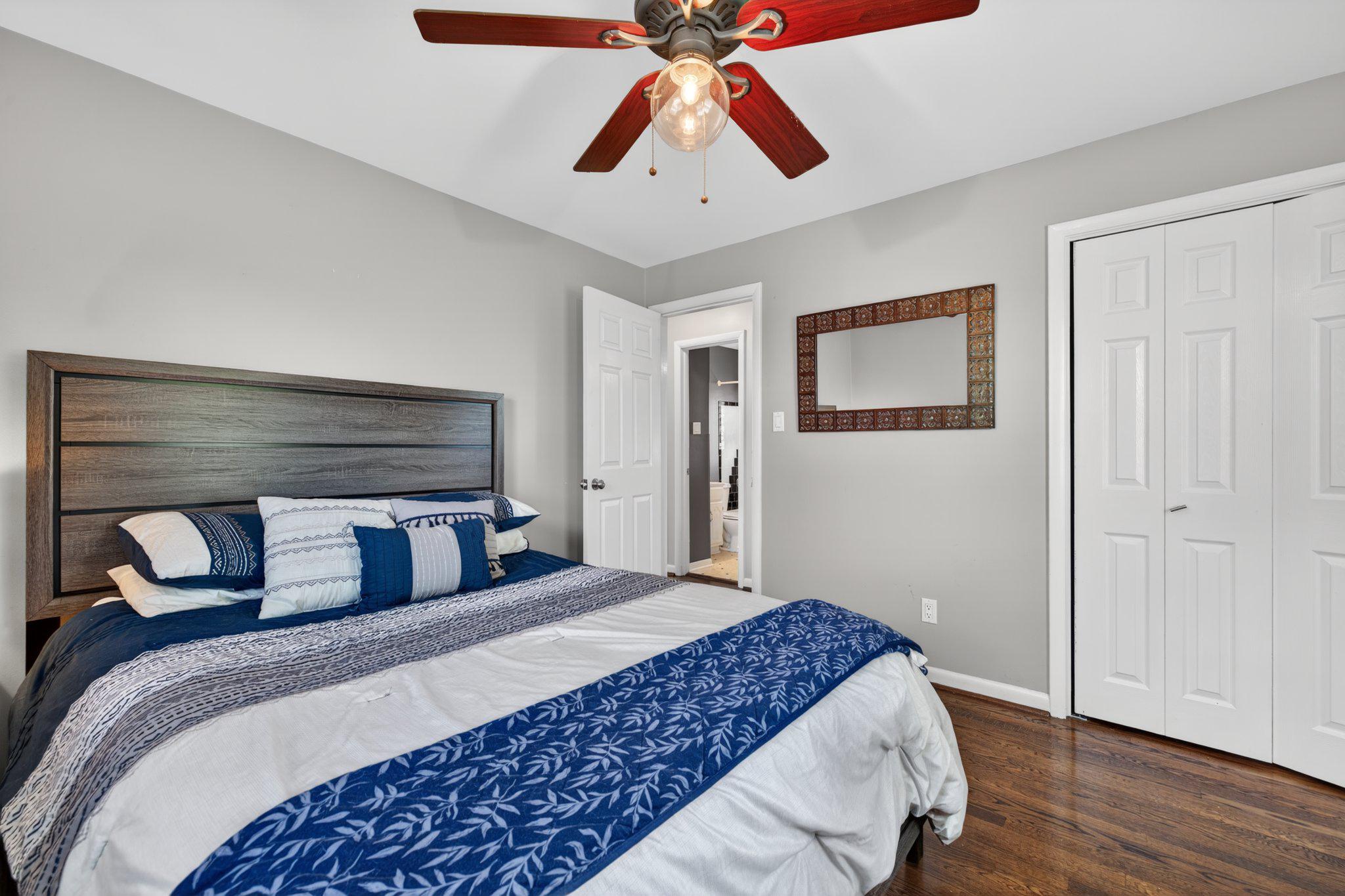 1002 Wilson Place Frederick, MD 21702 - Photo 11 of 30 a bedroom with a bed and a chandelier