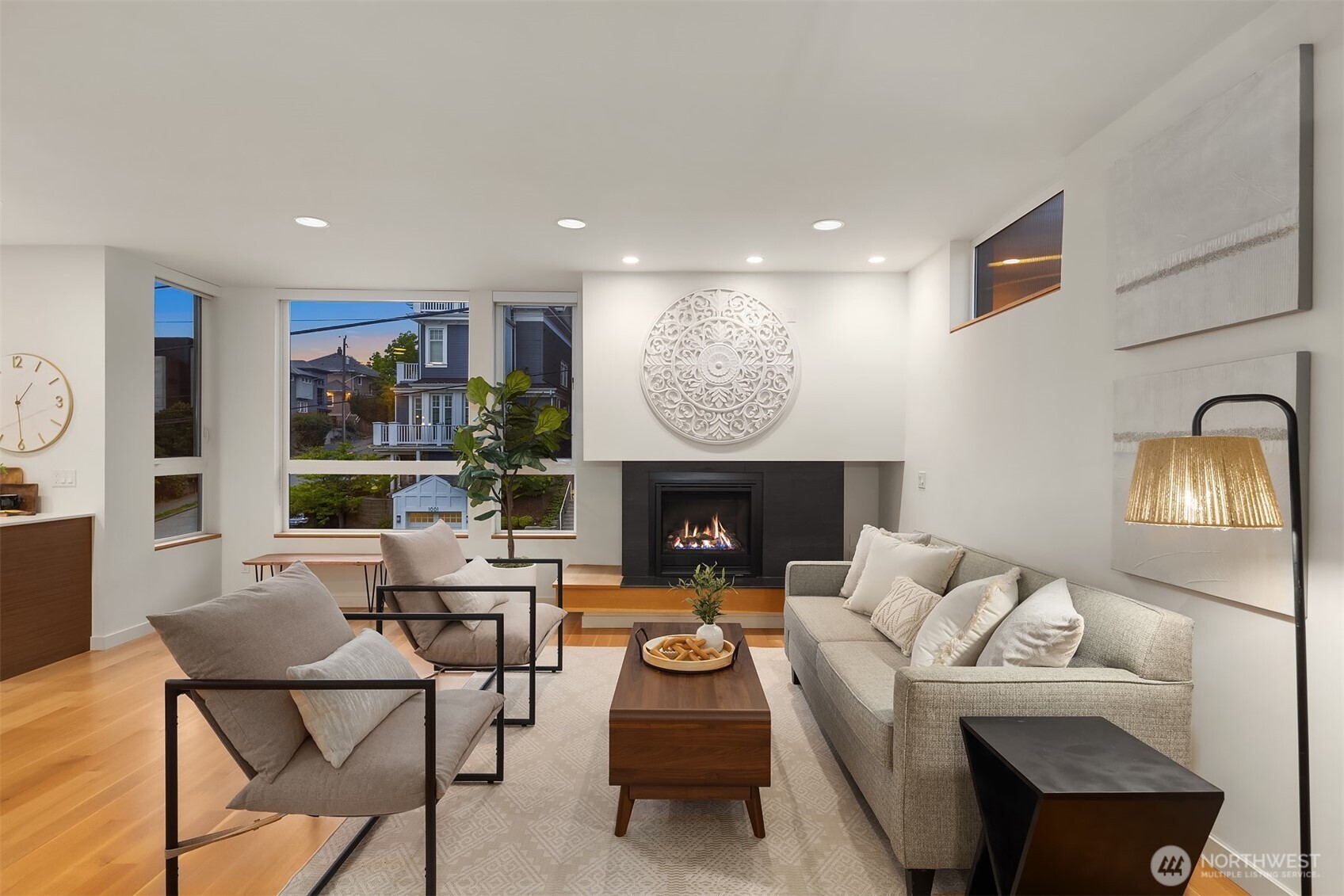 1002 5th Avenue North Seattle, WA 98109 - Photo 11 of 40 a living room with furniture and a fireplace