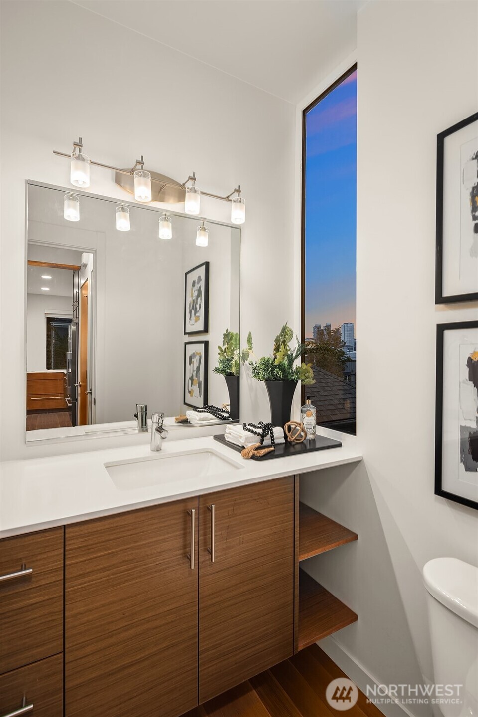 1002 5th Avenue North Seattle, WA 98109 - Photo 22 of 40 a bathroom with a sink and a mirror