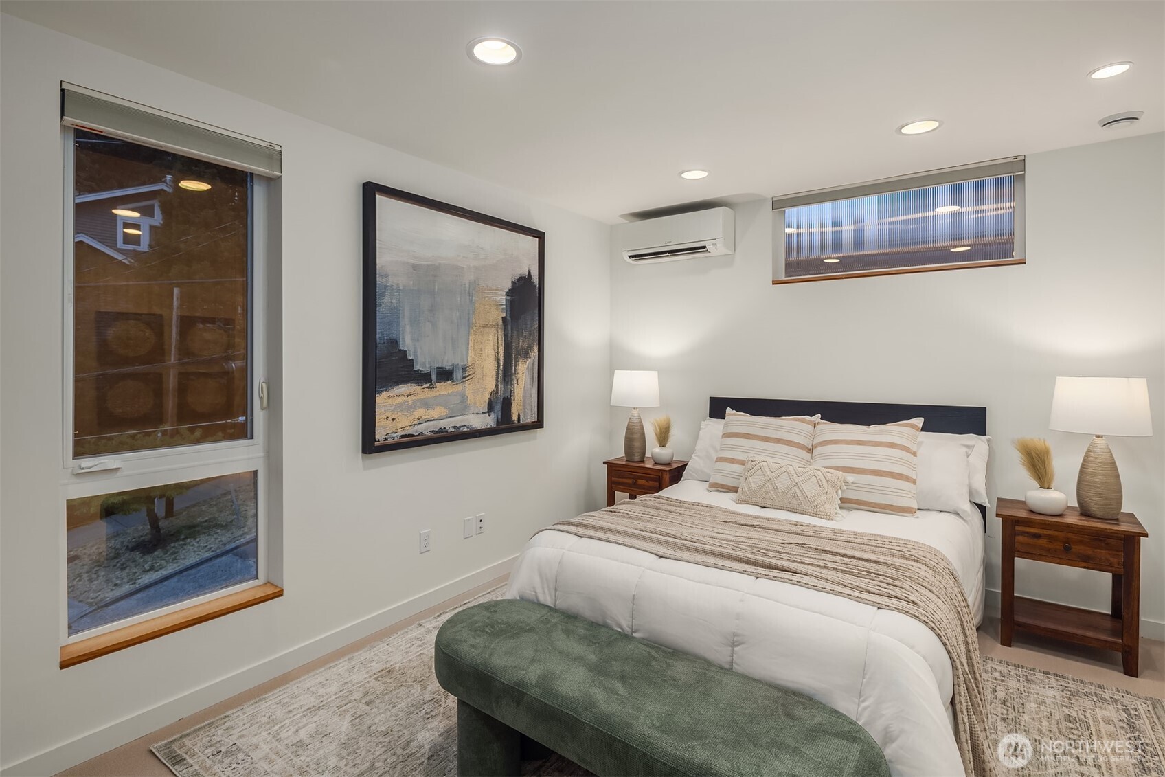 1002 5th Avenue North Seattle, WA 98109 - Photo 24 of 40 a bedroom with bed and wooden floor