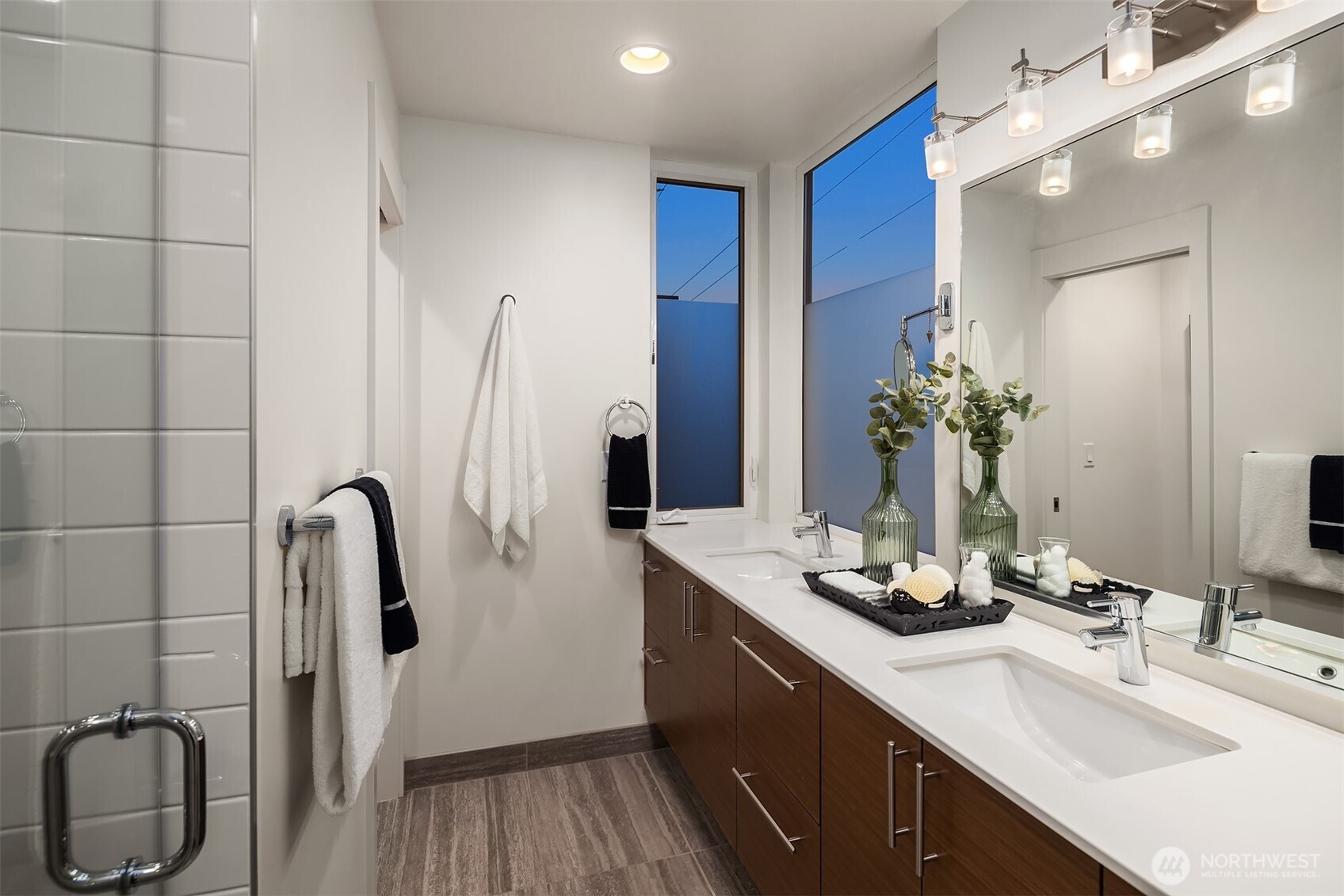 1002 5th Avenue North Seattle, WA 98109 - Photo 27 of 40 a bathroom with a sink vanity granite tub and shower