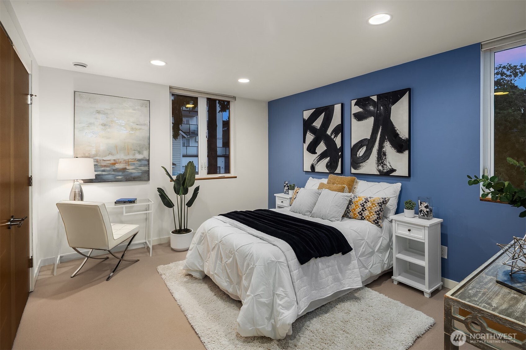 1002 5th Avenue North Seattle, WA 98109 - Photo 28 of 40 a bedroom with a bed and a chair in it