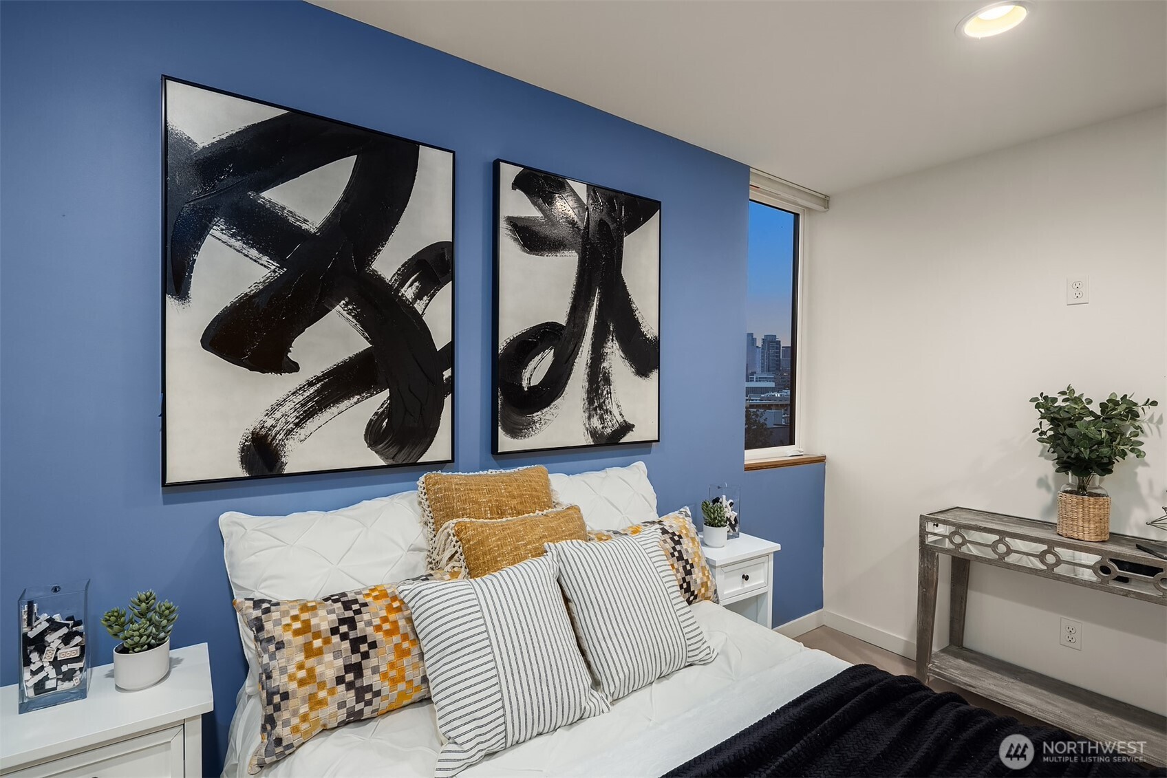 1002 5th Avenue North Seattle, WA 98109 - Photo 29 of 40 a living room with furniture and wall paintings