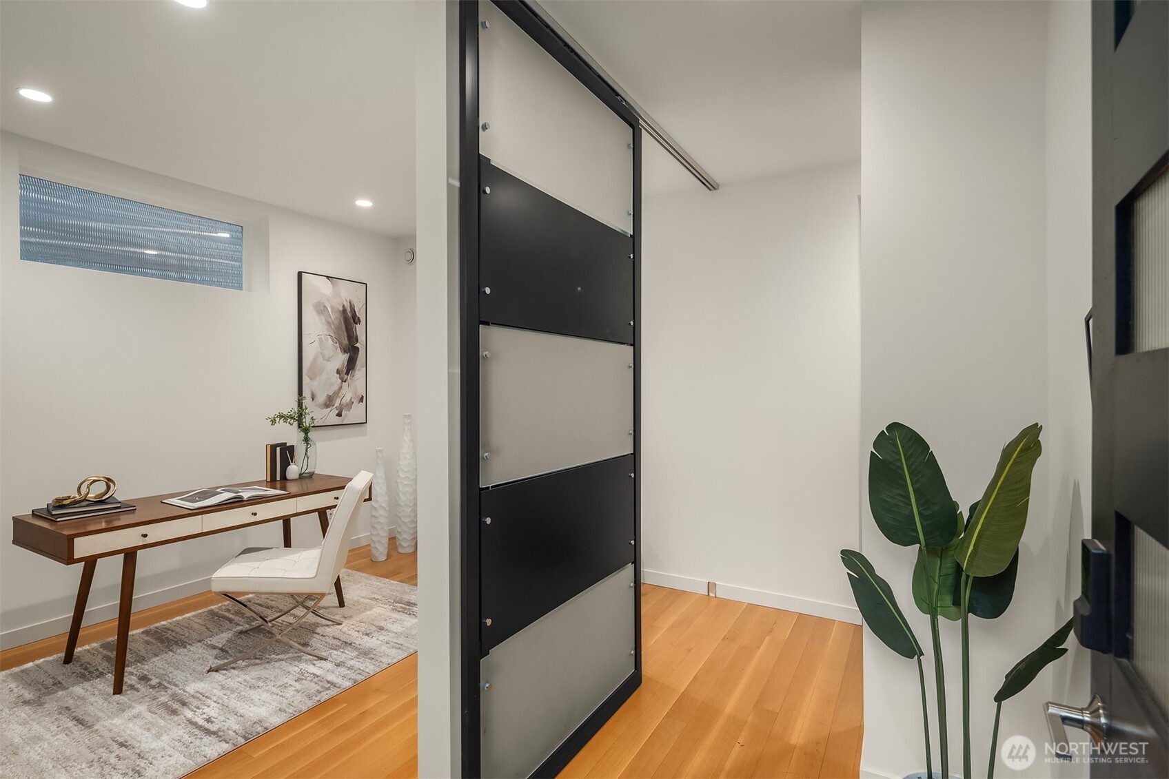 1002 5th Avenue North Seattle, WA 98109 - Photo 3 of 40 a living room with furniture and a potted plant