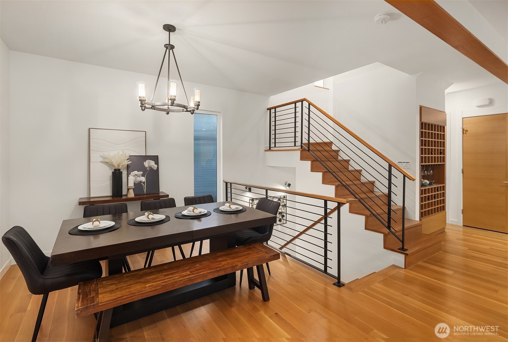 1002 5th Avenue North Seattle, WA 98109 - Photo 10 of 40 a view of a dining room with furniture and wooden floor