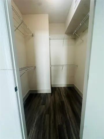 a view of an empty walk in closet