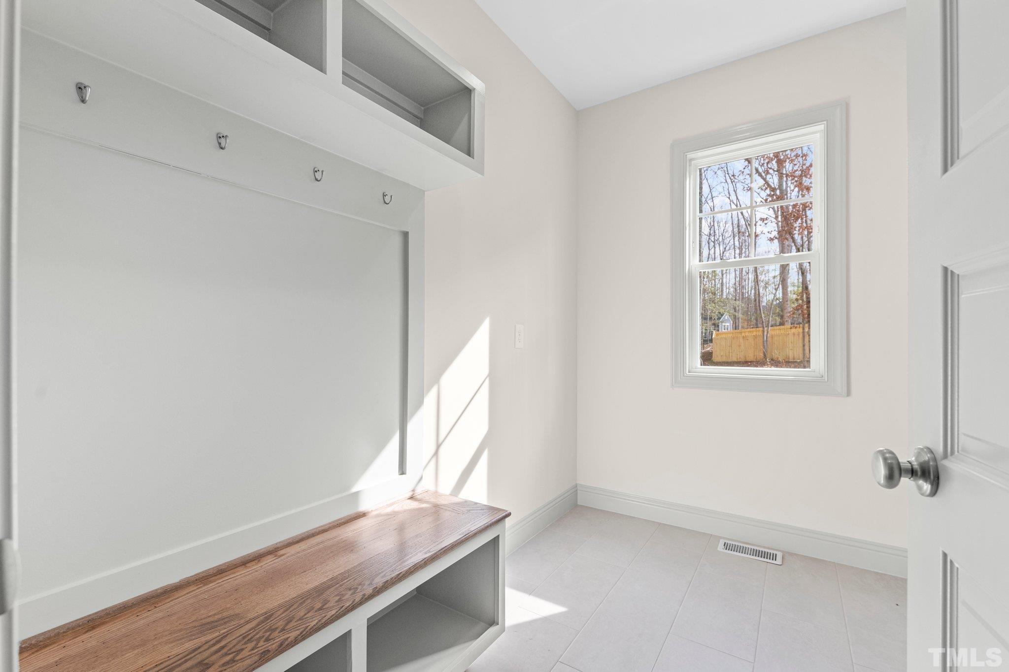 456 Reese Drive Willow Spring, NC 27592 - Photo 17 of 50 a view of an empty room with a window