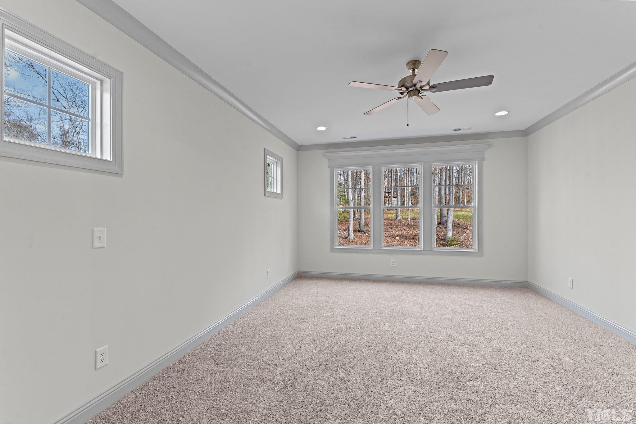 456 Reese Drive Willow Spring, NC 27592 - Photo 21 of 50 a view of an empty room with a window