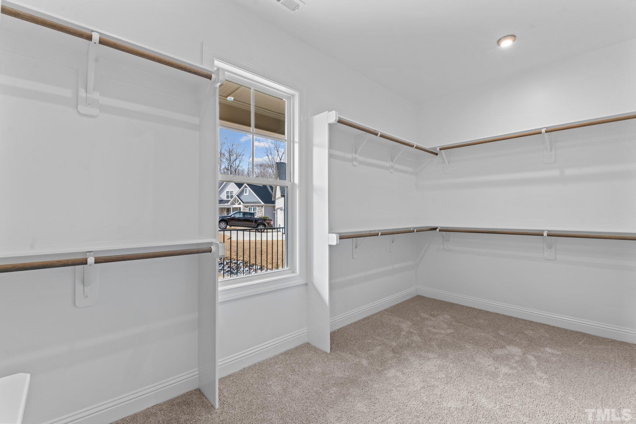 456 Reese Drive Willow Spring, NC 27592 - Photo 25 of 50 a view of an empty walk in closet