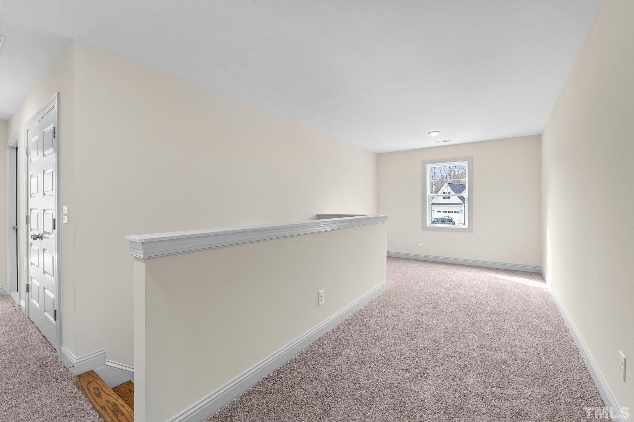 456 Reese Drive Willow Spring, NC 27592 - Photo 27 of 50 a view of an empty room and a window