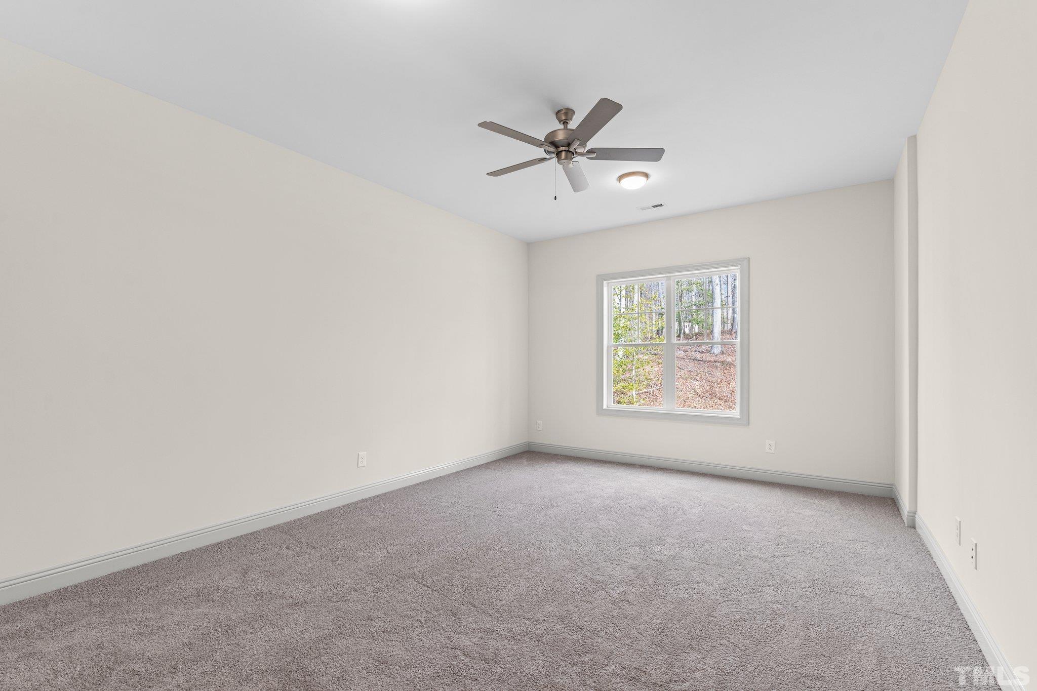 456 Reese Drive Willow Spring, NC 27592 - Photo 38 of 50 a view of an empty room with a window