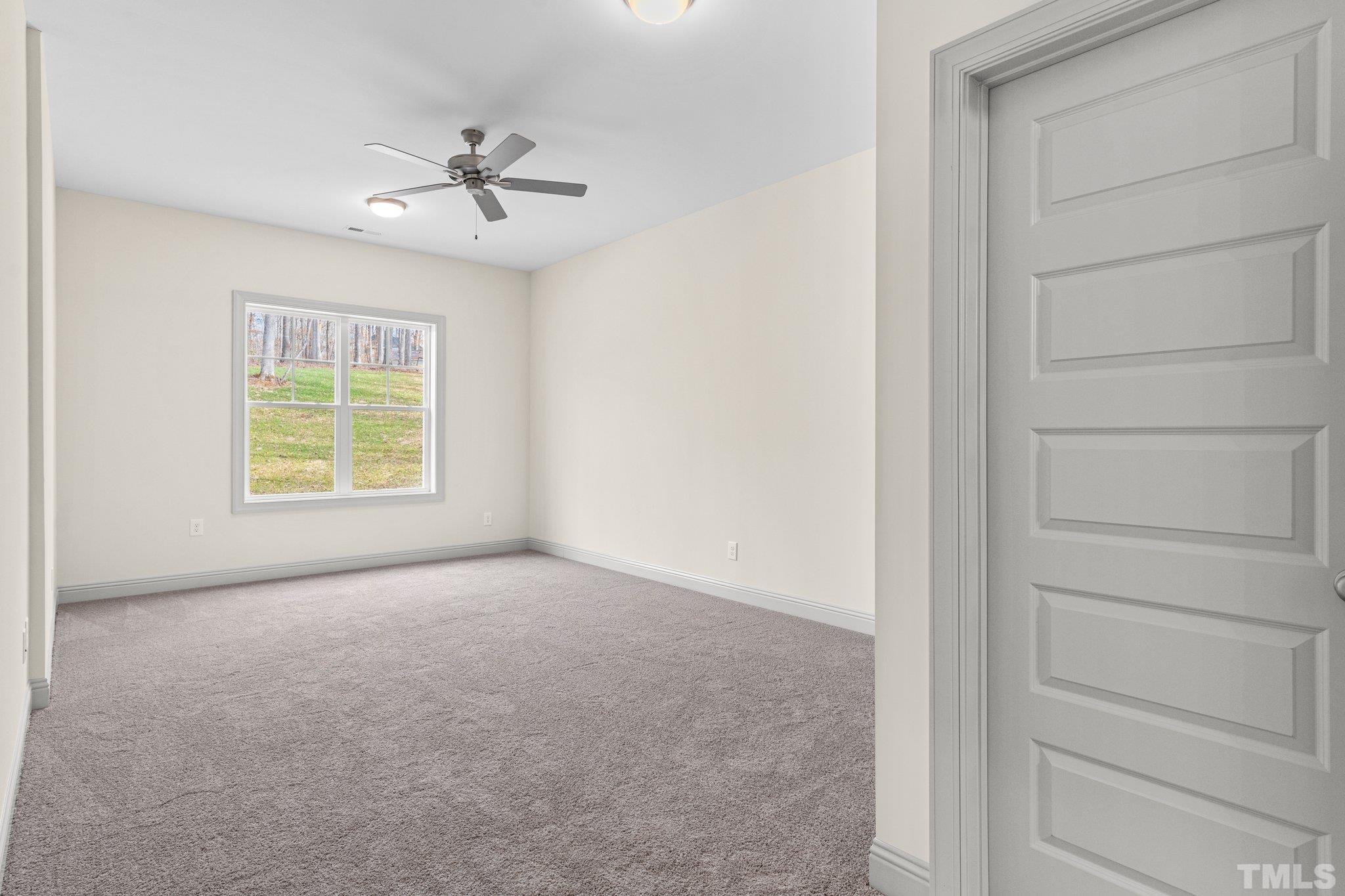 456 Reese Drive Willow Spring, NC 27592 - Photo 39 of 50 a view of an empty room with a window