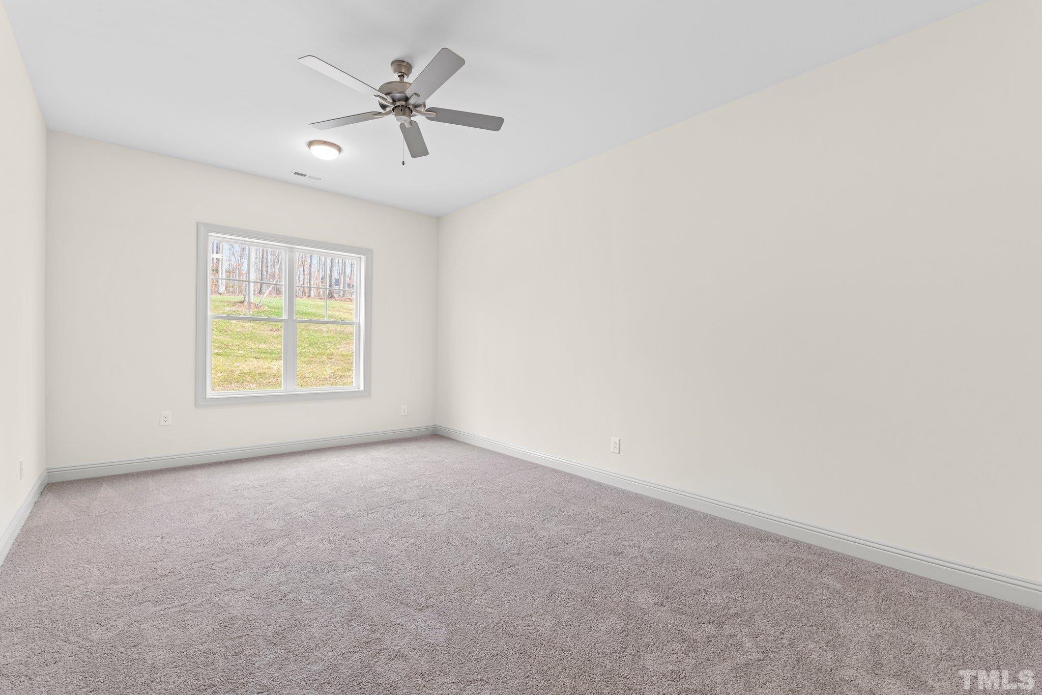 456 Reese Drive Willow Spring, NC 27592 - Photo 40 of 50 an empty room with windows and fan