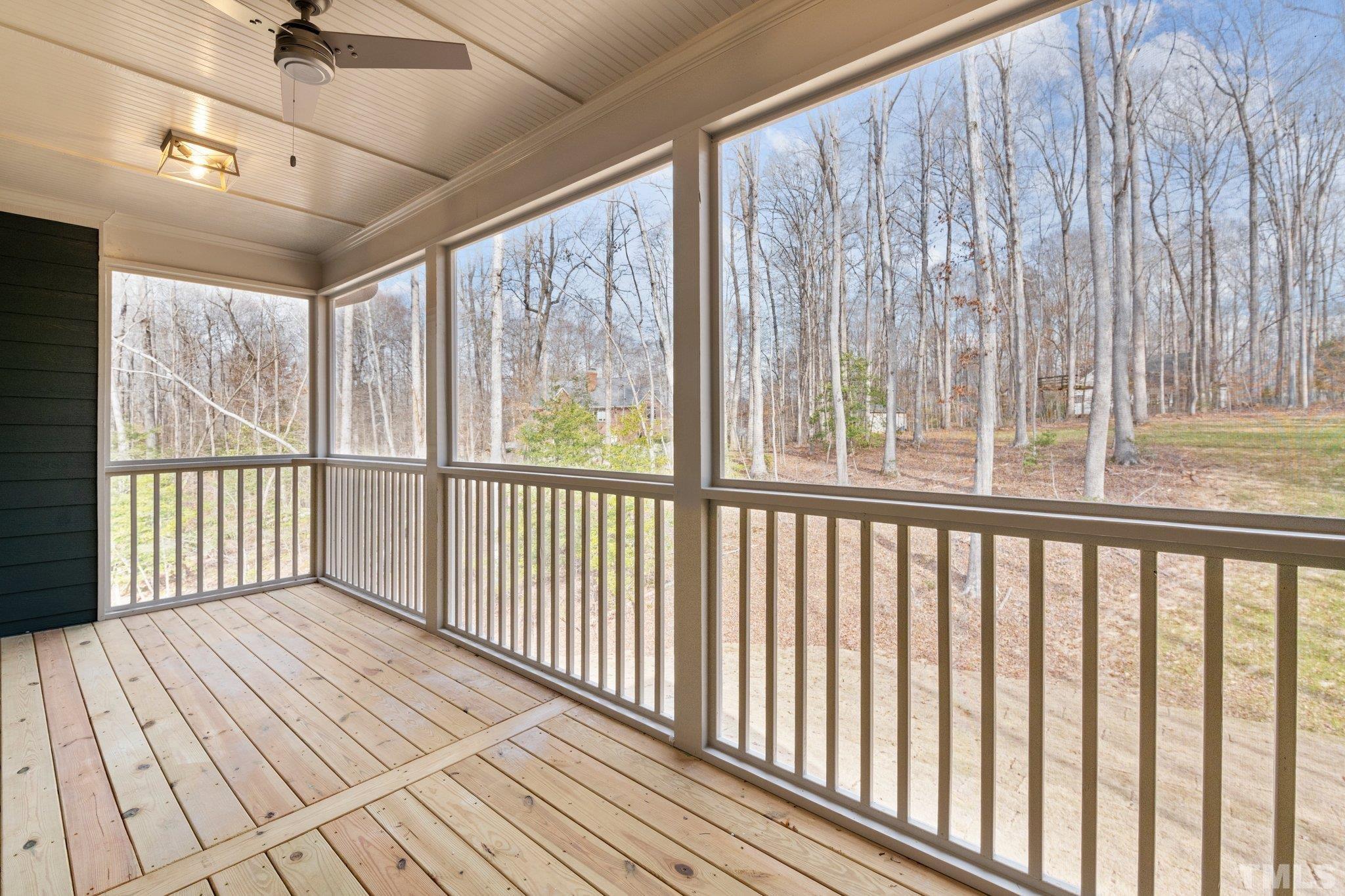 456 Reese Drive Willow Spring, NC 27592 - Photo 44 of 50 a view of a porch with wooden floor