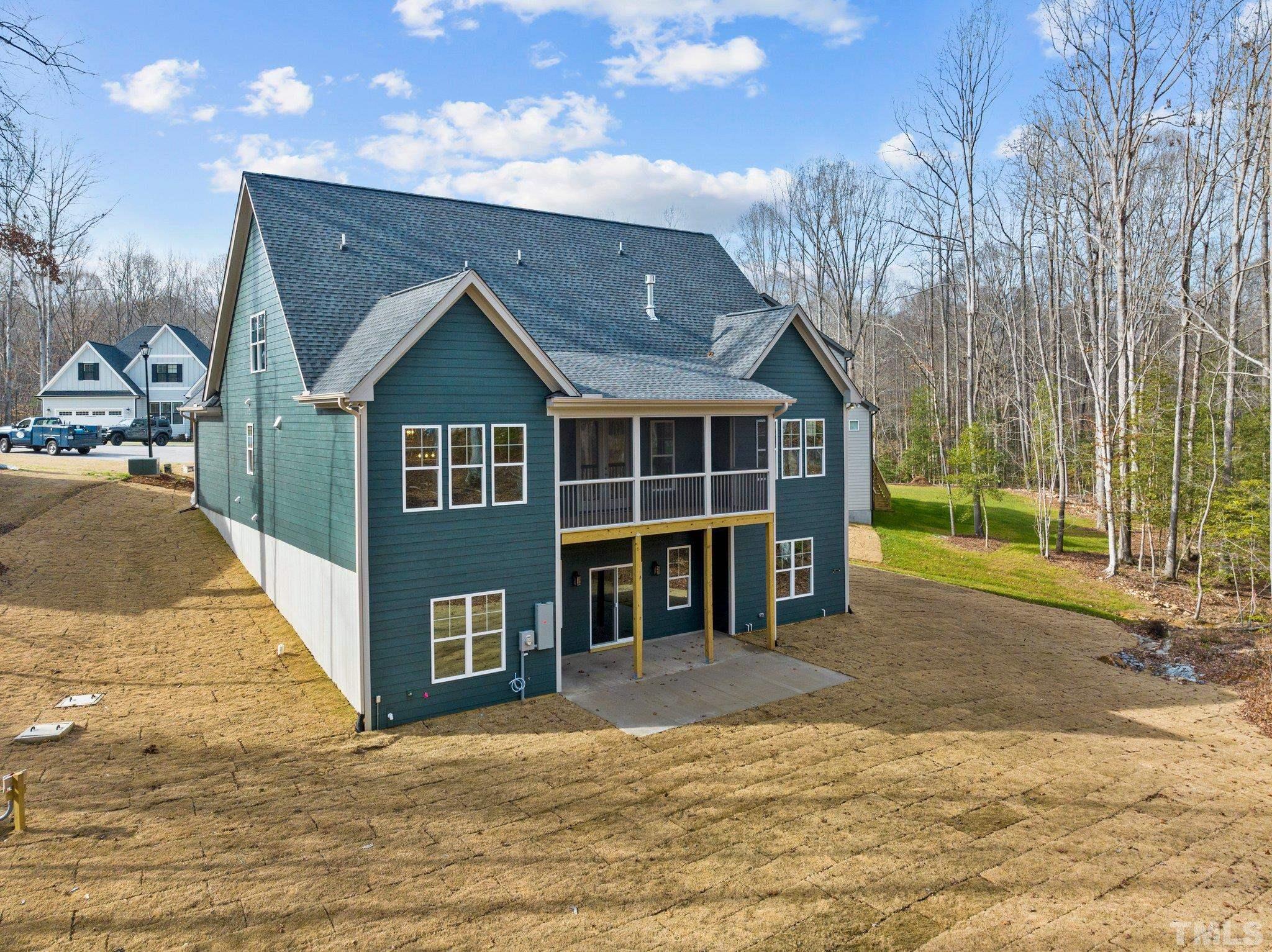 456 Reese Drive Willow Spring, NC 27592 - Photo 47 of 50 a front view of a house with a yard and garage