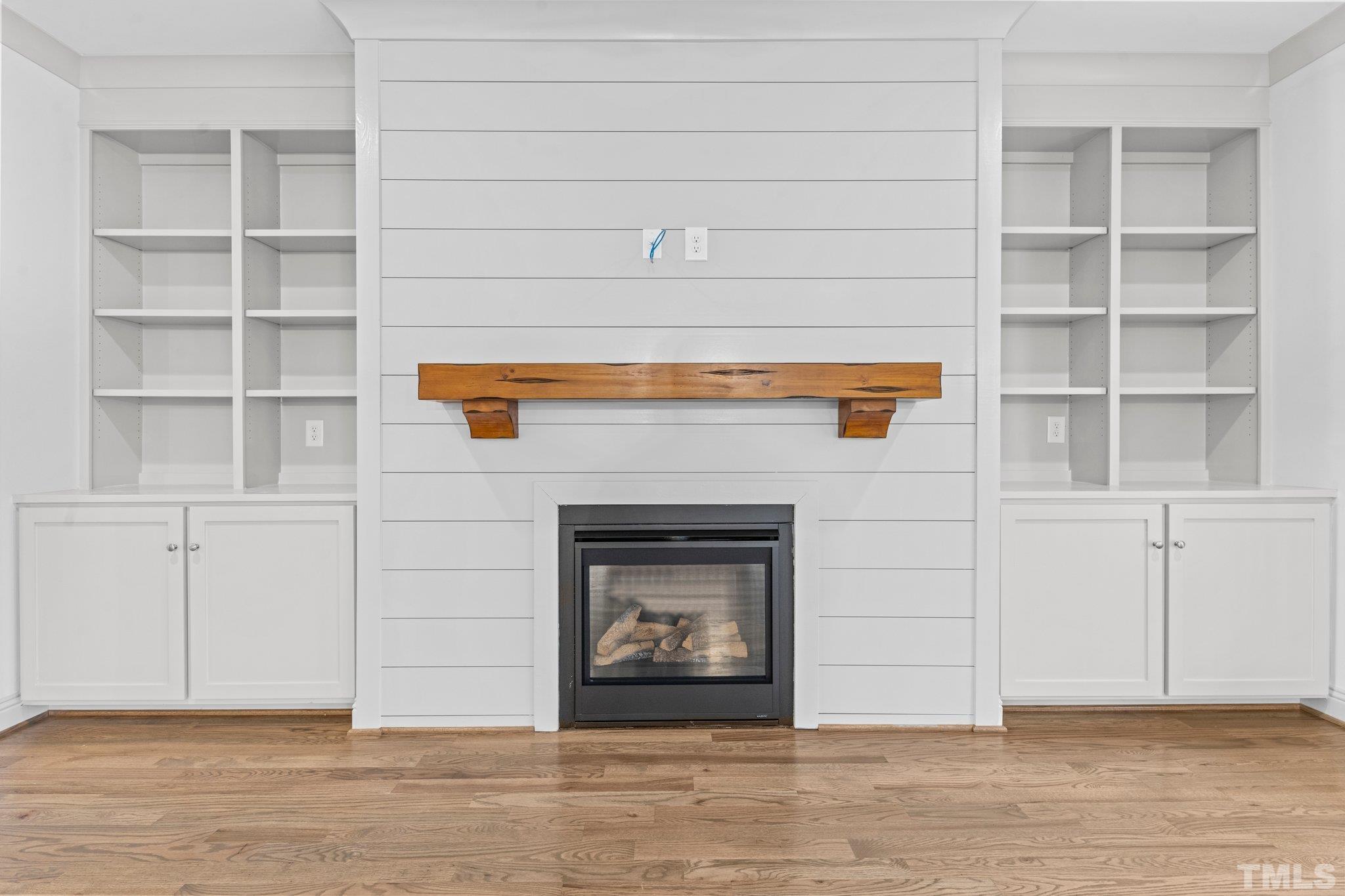 456 Reese Drive Willow Spring, NC 27592 - Photo 9 of 50 a view of an empty room with wooden floor and a window