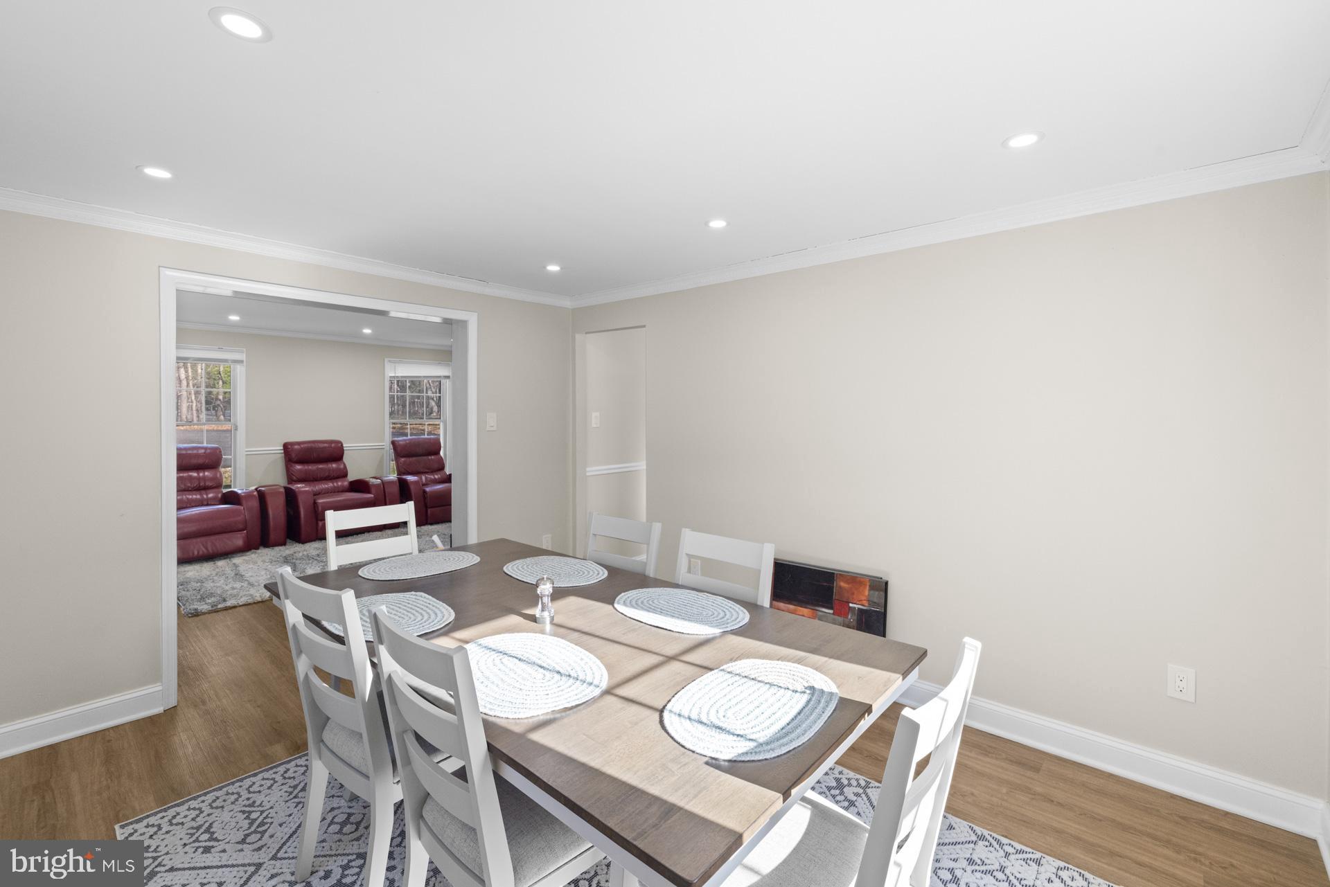 2907 Accokeek Road West Accokeek, MD 20607 - Photo 15 of 42 a view of a dining room with furniture and a wooden floor