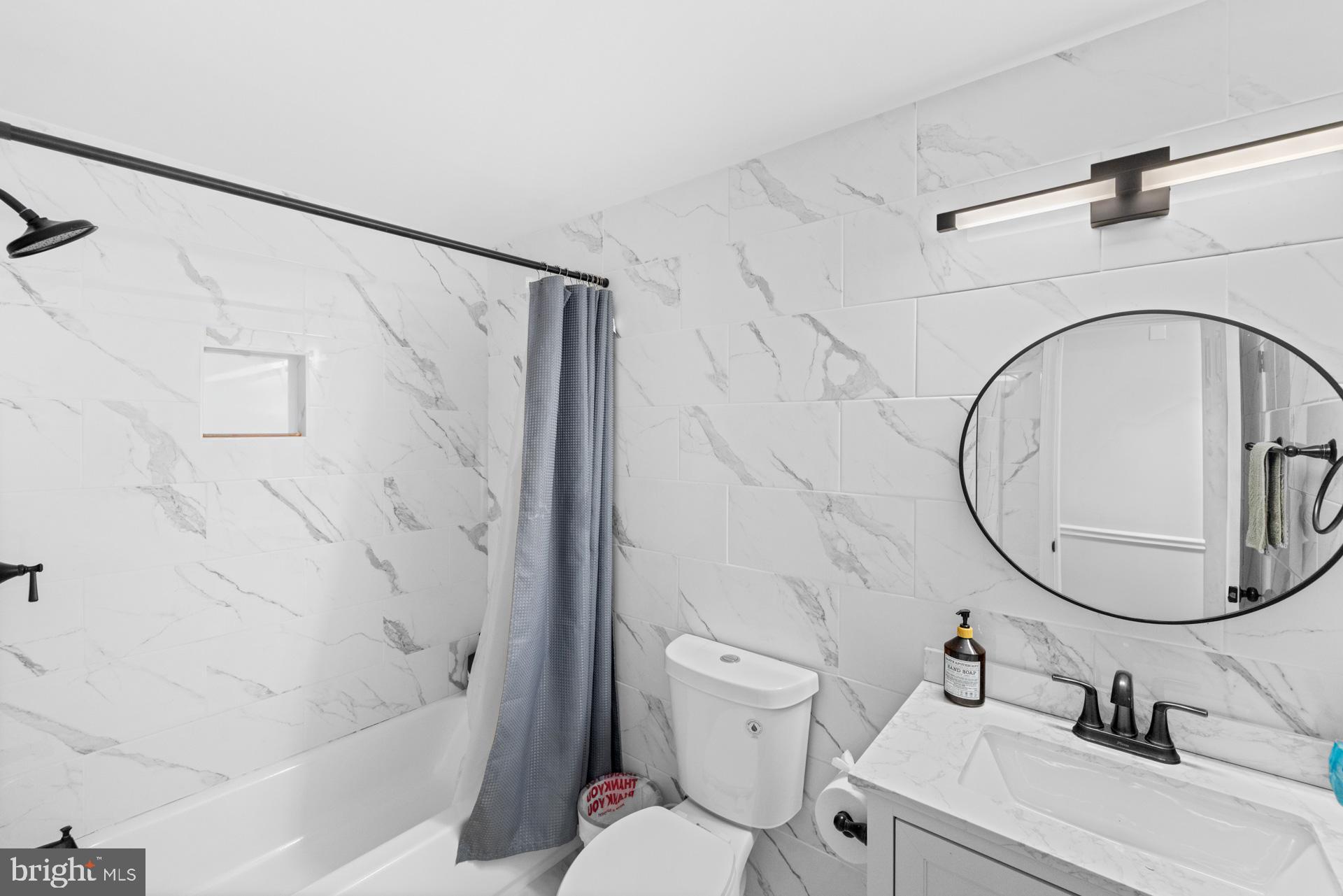 2907 Accokeek Road West Accokeek, MD 20607 - Photo 26 of 42 a bathroom with a sink a toilet and a mirror