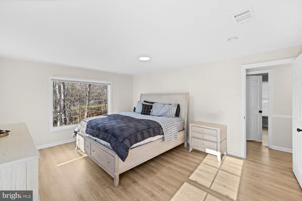 a bedroom with a bed and a cabinets
