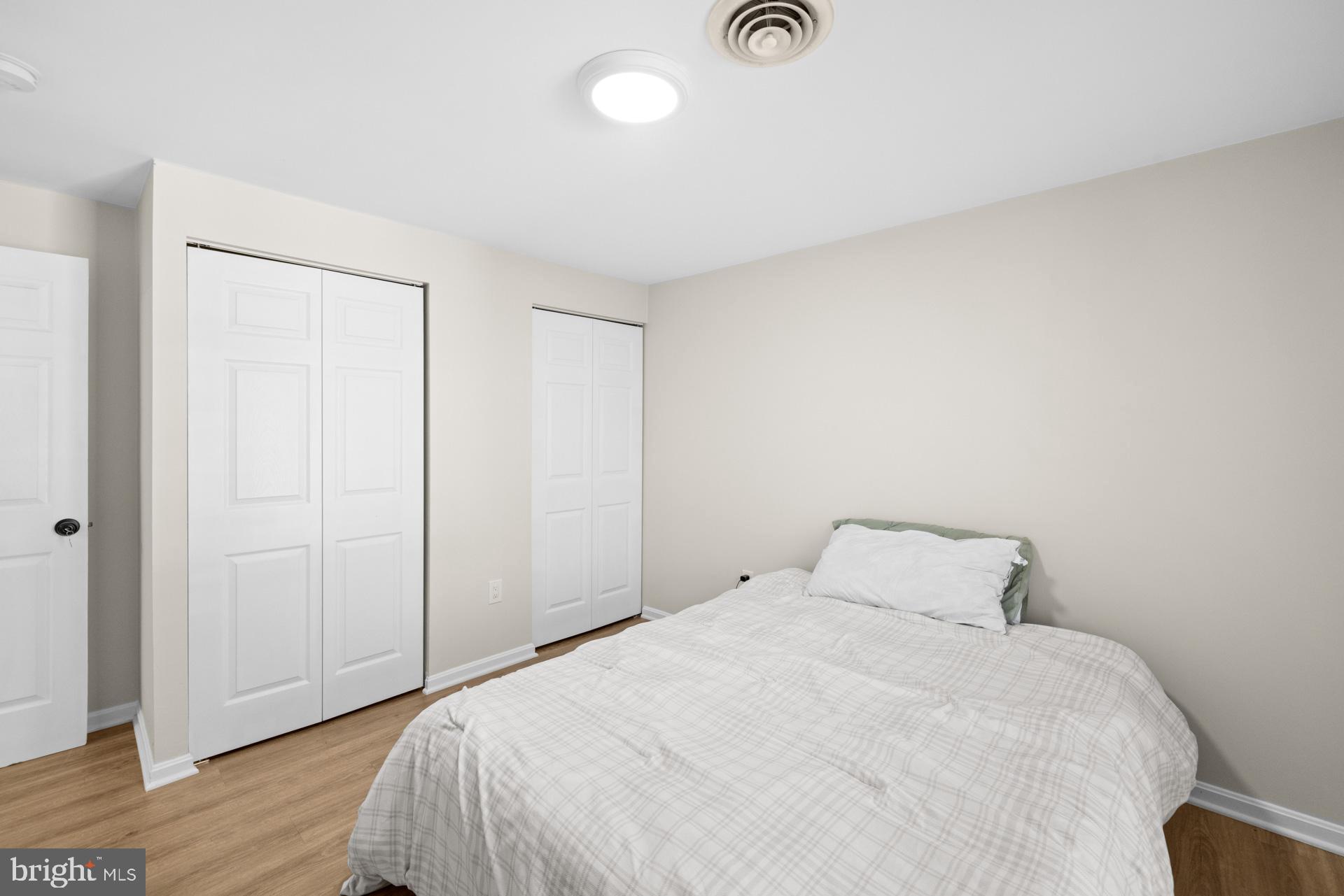 2907 Accokeek Road West Accokeek, MD 20607 - Photo 35 of 42 a bedroom with a bed and wooden floor