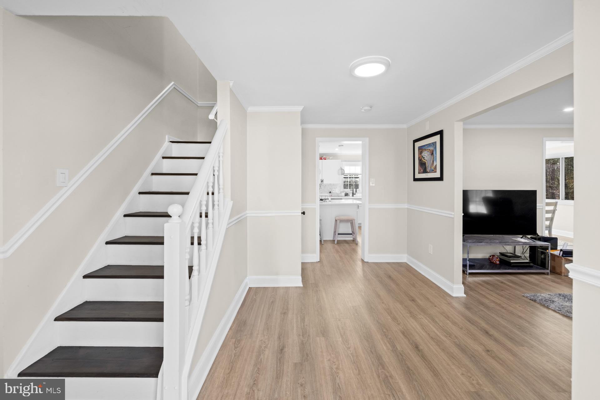 2907 Accokeek Road West Accokeek, MD 20607 - Photo 9 of 42 a view of a livingroom with wooden floor and white walls