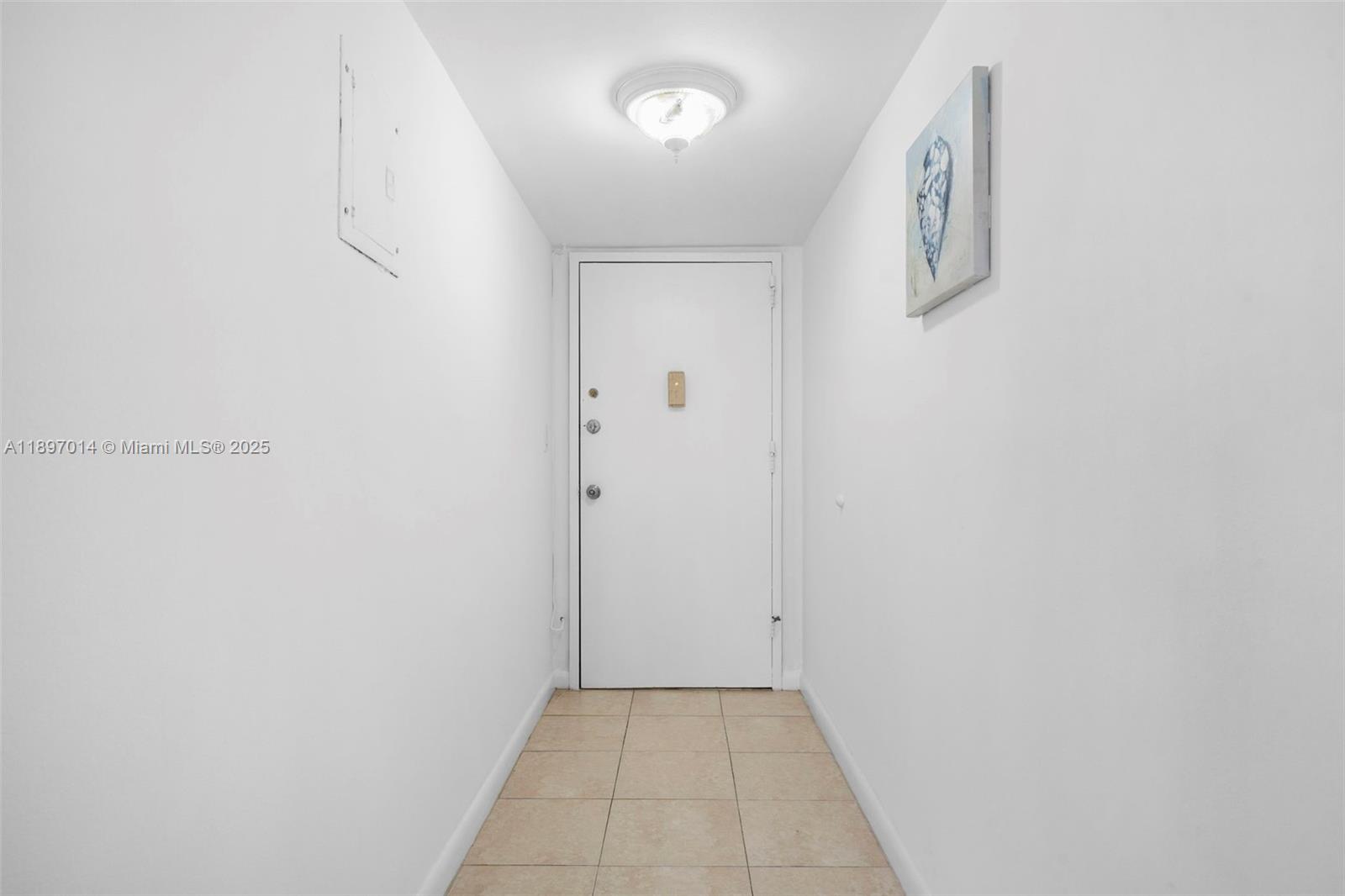 401 Golden Isles Drive, Unit 304 Hallandale Beach, FL 33009 - Photo 24 of 43 a view of a hallway