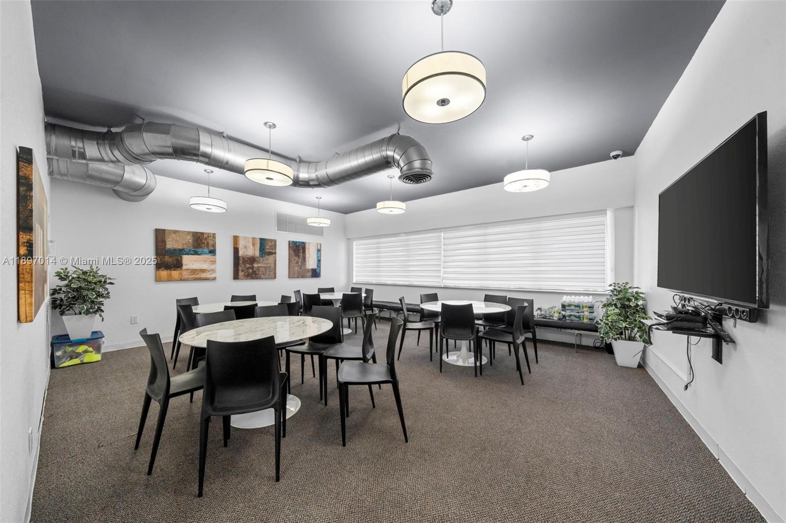 401 Golden Isles Drive, Unit 304 Hallandale Beach, FL 33009 - Photo 30 of 43 a view of a dining room with furniture