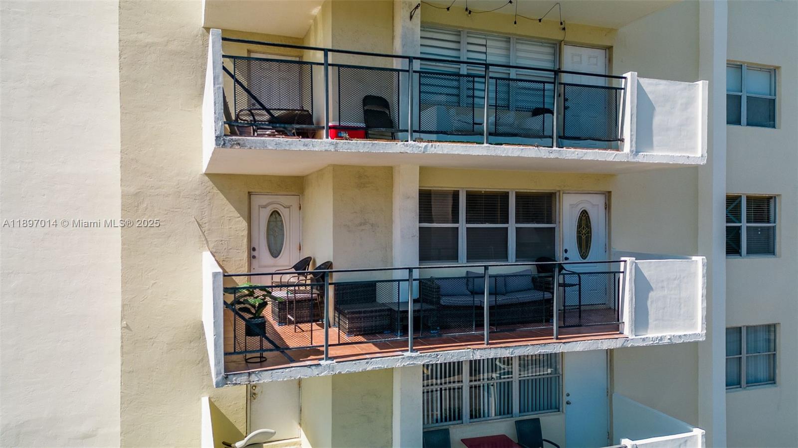 401 Golden Isles Drive, Unit 304 Hallandale Beach, FL 33009 - Photo 35 of 43 a view of houses with a outdoor space