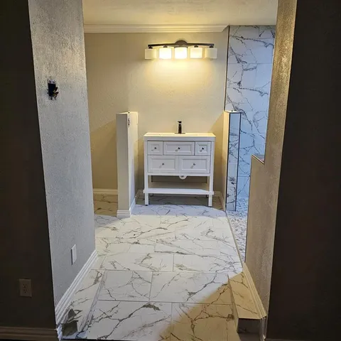 a bathroom with a bathtub sink and a shower