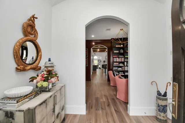 a dining room with furniture and wooden floor