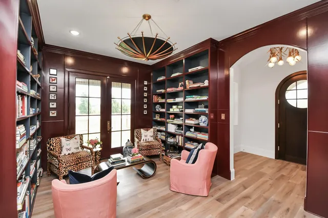 a very nice looking room with many windows and white walls