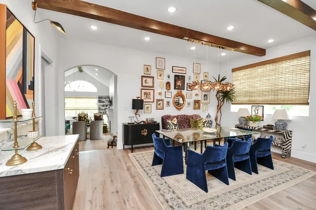 a large kitchen with a table and chairs