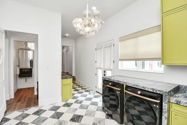 a kitchen with stainless steel appliances granite countertop a stove and a sink