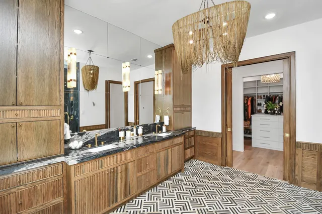a spacious bathroom with a double vanity sink and a mirror