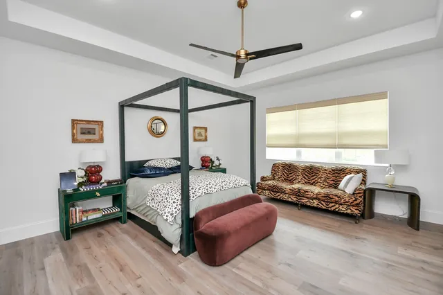 a bedroom with a bed and a couch