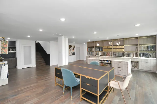 a kitchen with a table and chairs