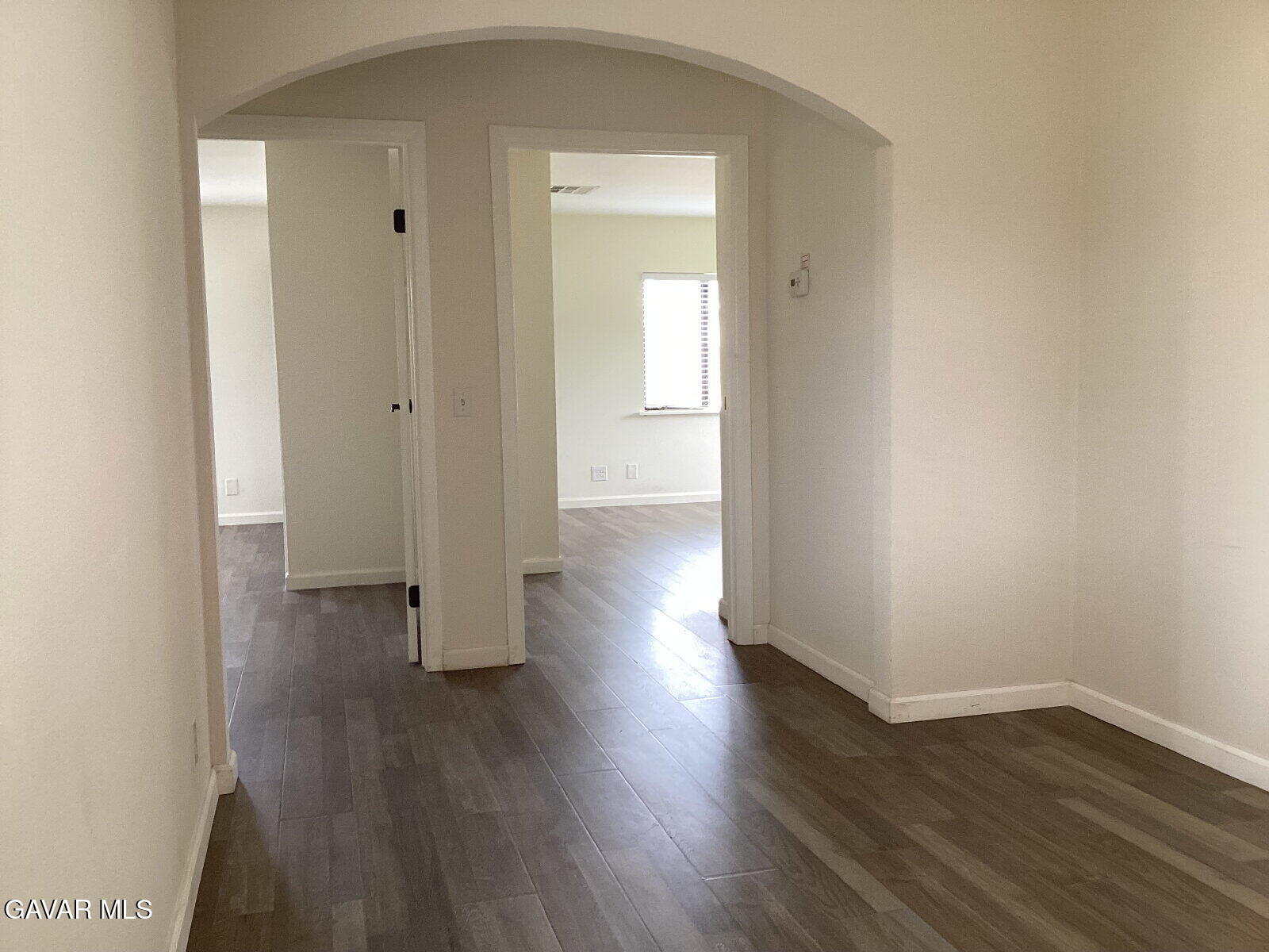 43324 45th Street West Lancaster, CA 93536 - Photo 2 of 10 a view of a hallway with wooden floor