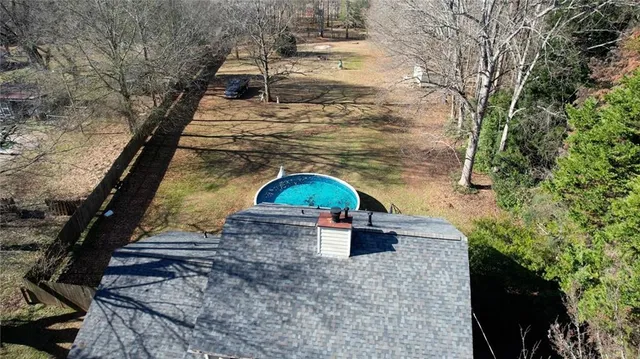 a view of a tree in front of a house