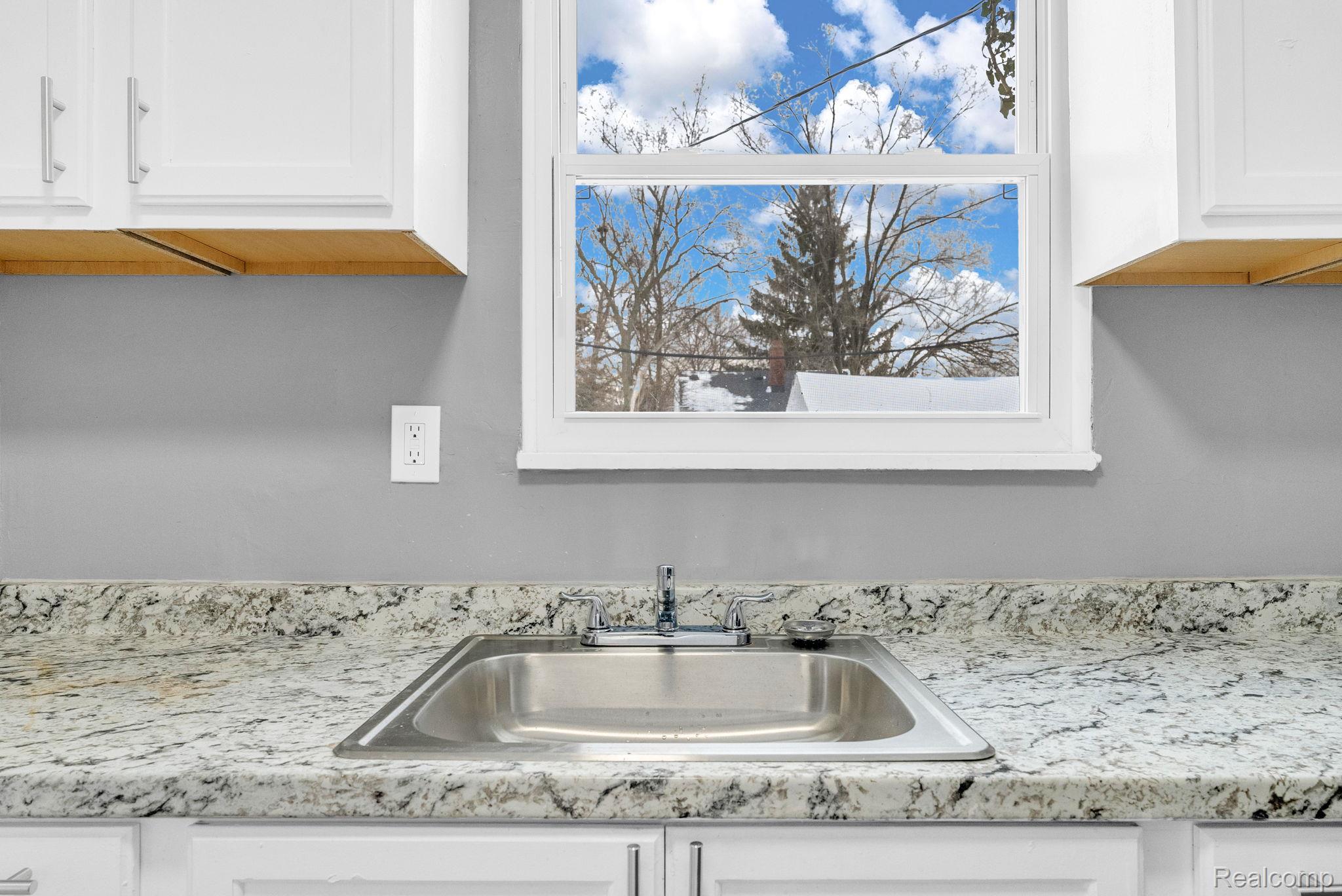 10808 Nottingham Road Detroit, MI 48224 - Photo 10 of 26 Kitchen view of white cabinetry and light stone countertops