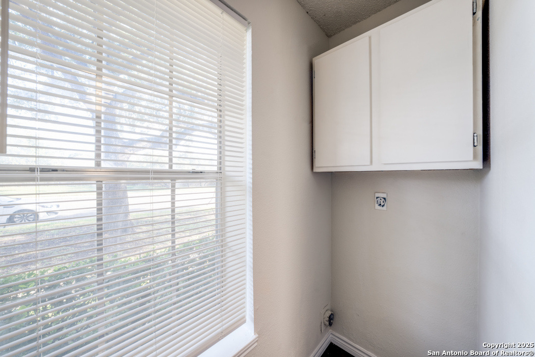 10254 Dover Ridge, Unit 204 San Antonio, TX 78250 - Photo 20 of 31 a view of a closet area with wooden floor