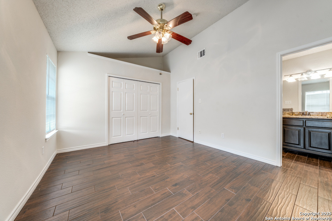 10254 Dover Ridge, Unit 204 San Antonio, TX 78250 - Photo 22 of 31 a view of an empty room with window and wooden floor