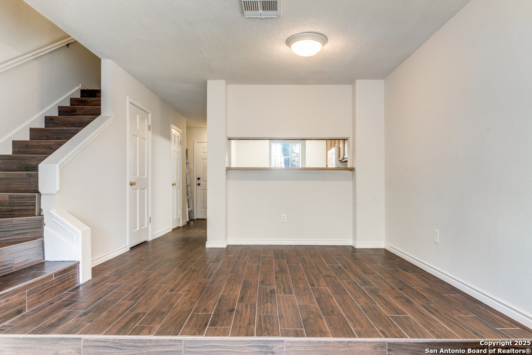 10254 Dover Ridge, Unit 204 San Antonio, TX 78250 - Photo 10 of 31 wooden floor in an empty room