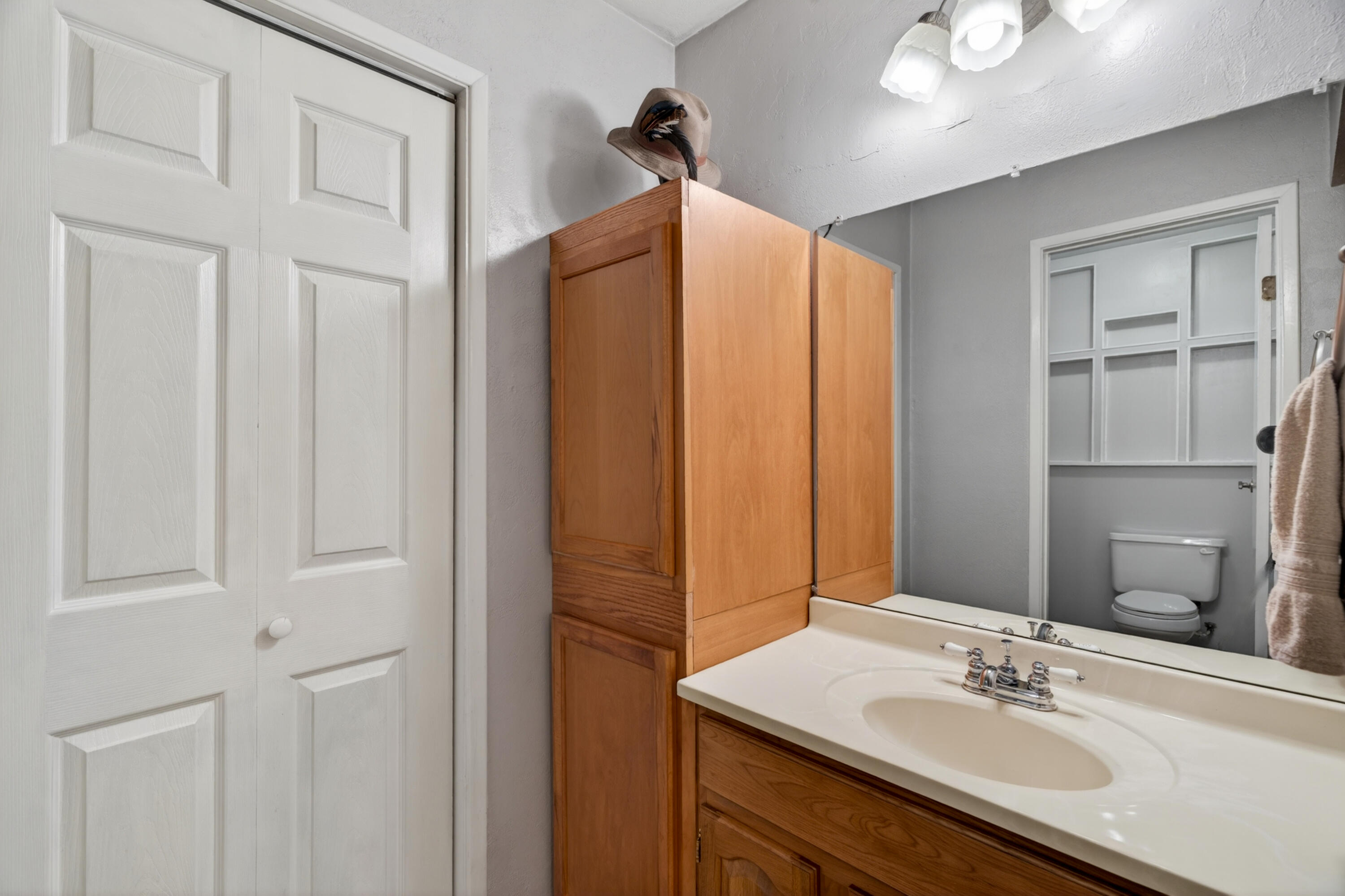 8015 Starlite Pines Road Shingletown, CA 96088 - Photo 23 of 38 a bathroom with a sink vanity granite and a mirror