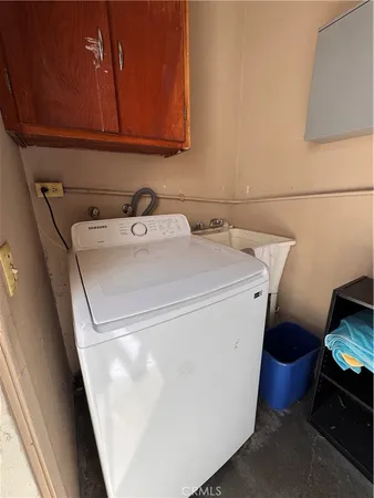 a view of a backyard with wooden fence