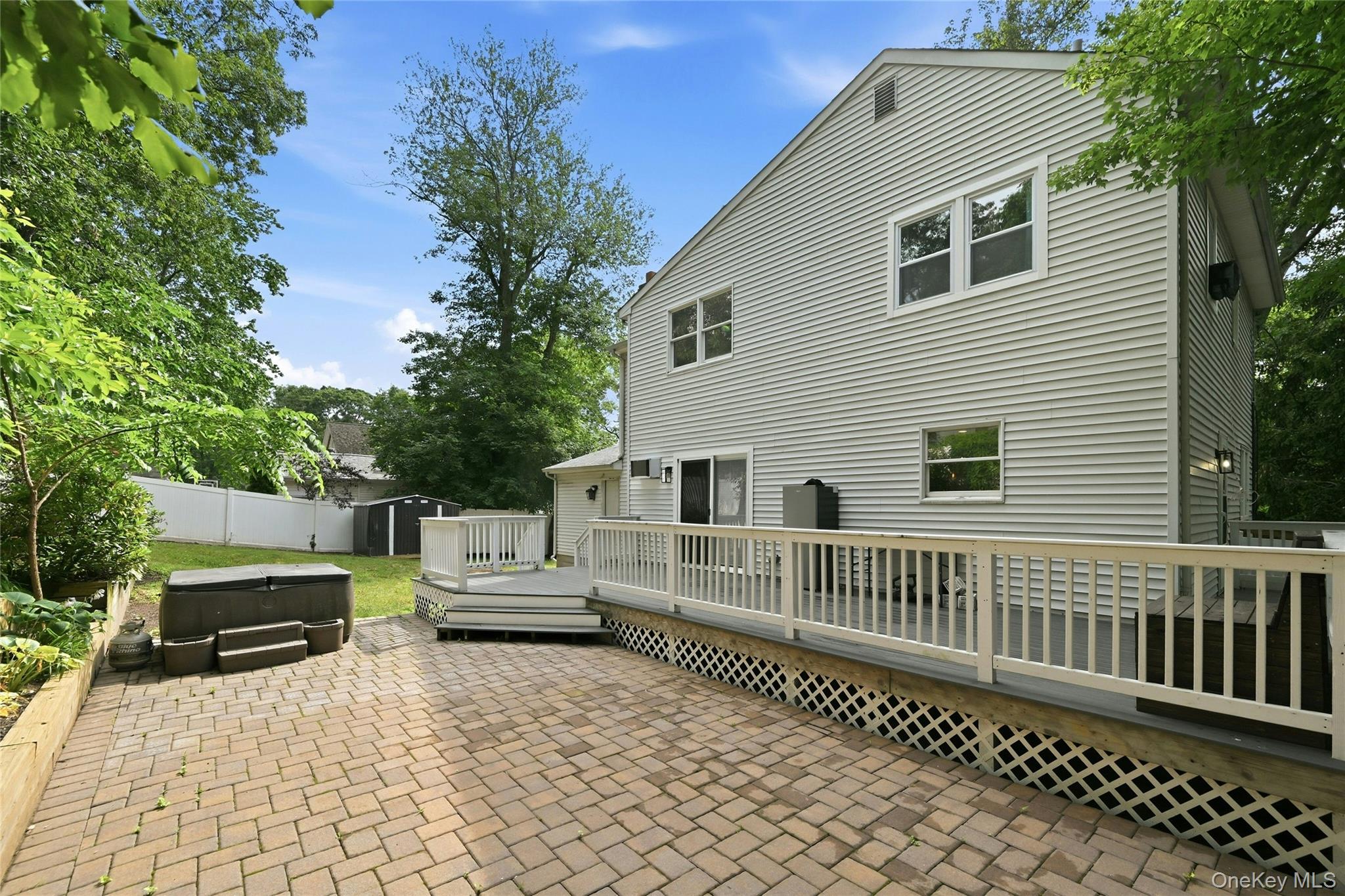 15 Birch Road Rocky Point, NY 11778 - Photo 28 of 30 Patio and deck for outdoor entertaining, Sliders into the Sitting Room