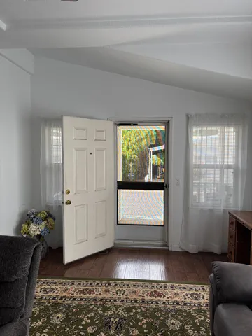 a view of a livingroom with furniture and window