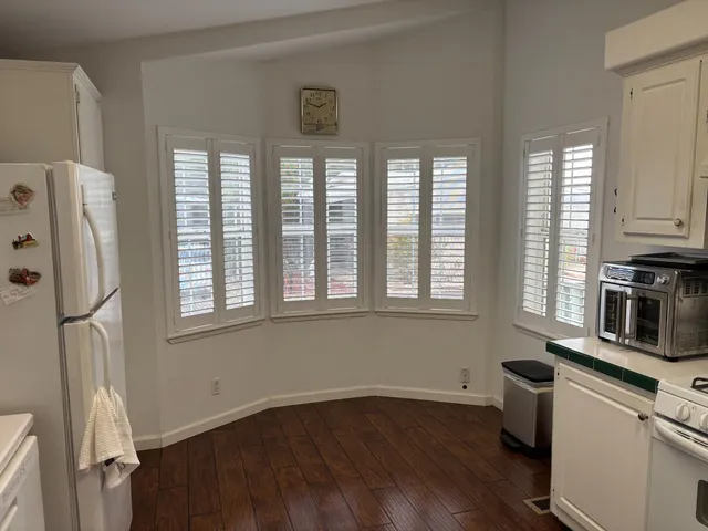 a kitchen with stainless steel appliances a refrigerator sink and microwave